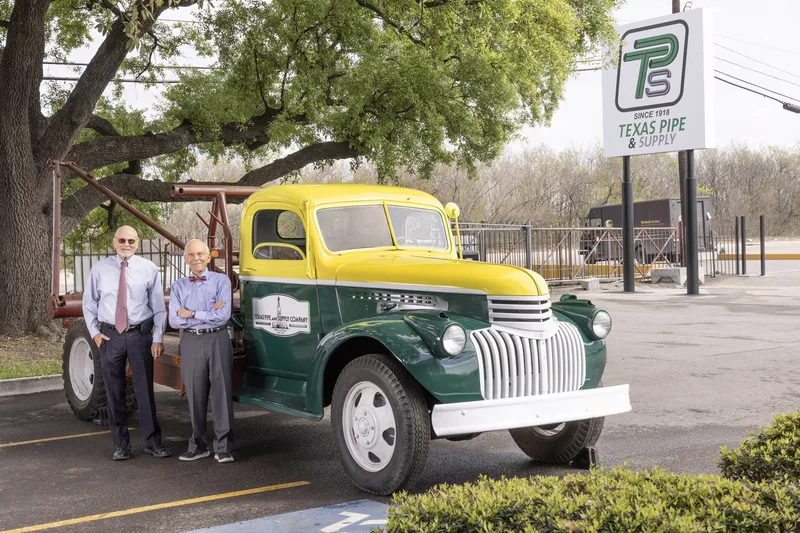 Corporate headshot session with vintage company truck and branded signage