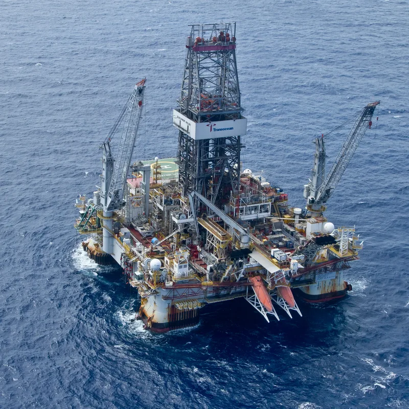 steel offshore drilling rigs semi-submersible platform cranes aerial ocean view