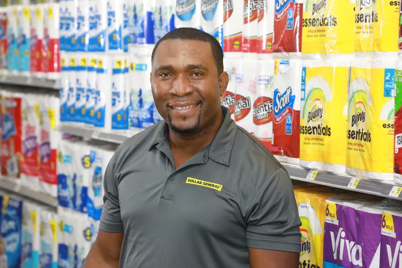 Corporate headshot session with Dollar General employee in store aisle