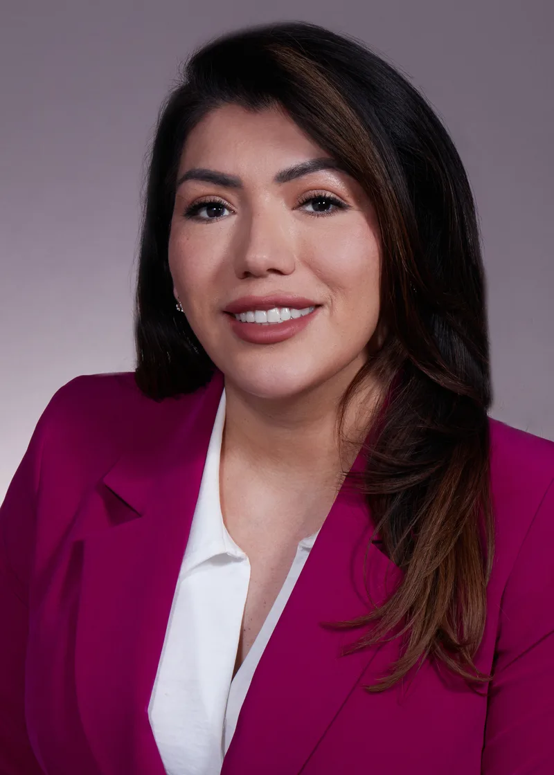 corporate headshot woman magenta blazer white blouse soft gray background