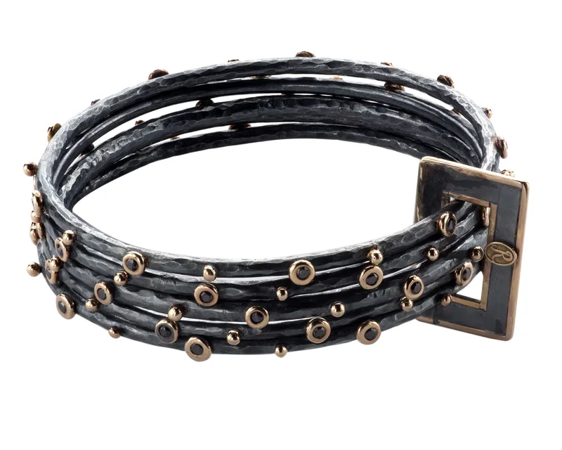 Oxidized silver multi-strand bracelet with rose gold diamond accents — jewelry photography