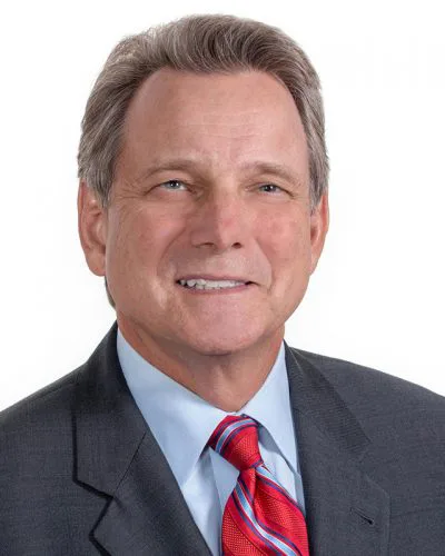 business headshot gray suit red striped tie light blue shirt white background