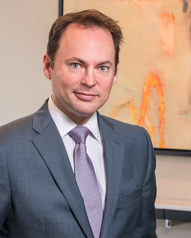 Corporate headshot professional man gray suit lavender tie abstract painting backdrop