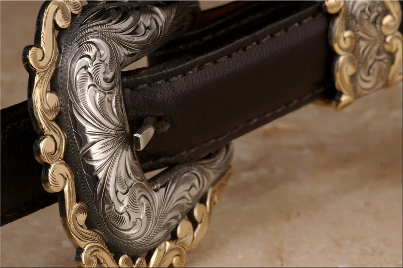 Western buckle silver engraved scrollwork gold accents dark leather belt
